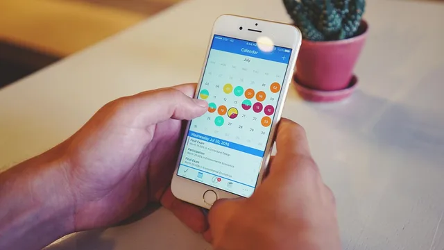 calendar, cellphone, display, electronics, equipment, hand, indoors, internet, potted plant, screen, smartphone, table, technology, touch, calendar, calendar, calendar, calendar, calendar. Building a shared calendar for business reporting